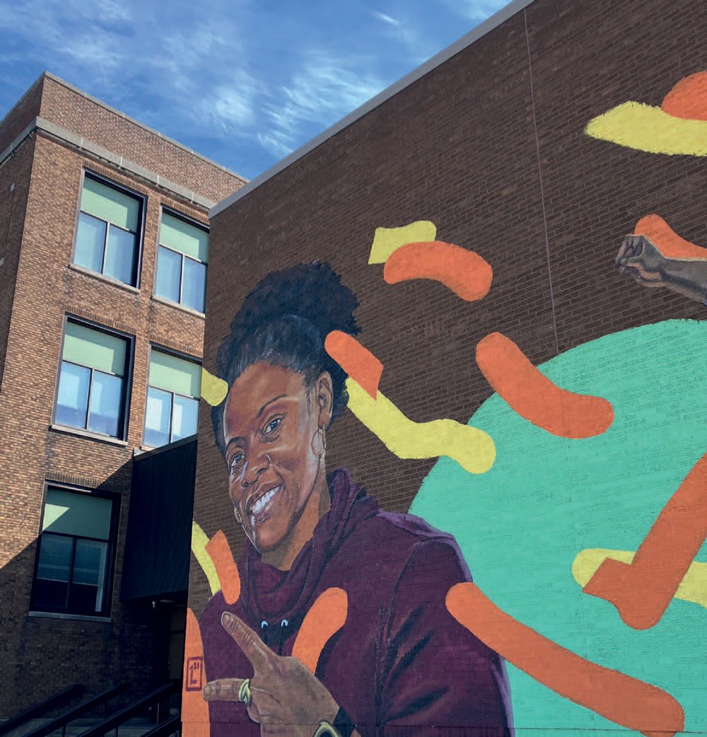 mural-on-building-woman-w-peace-sign